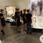 Group of school children in a museum gallery