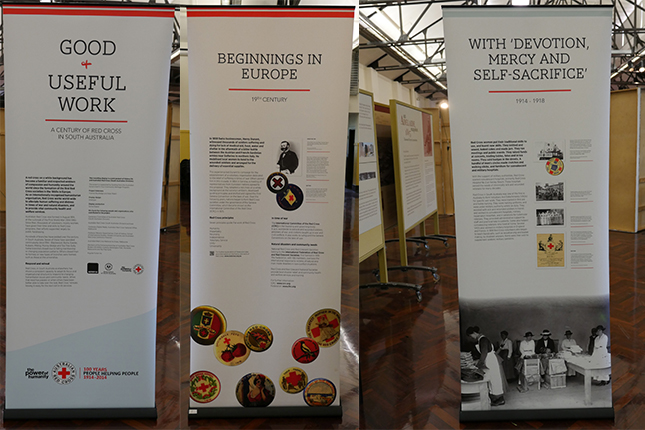 Three pull up banners showing text and images related to Red Cross.