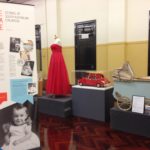 Display of items including a red dress