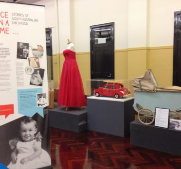 Display of items including a red dress