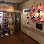 Screen showing sign language as part of gallery display.